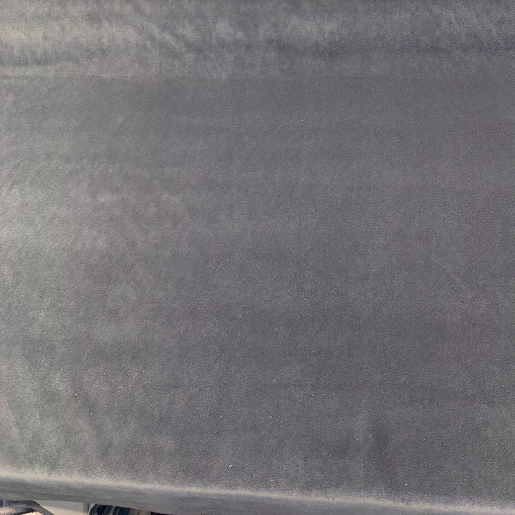 Charcoal gray Crypton Sintra Shark velvet upholstery fabric laid flat on the roll