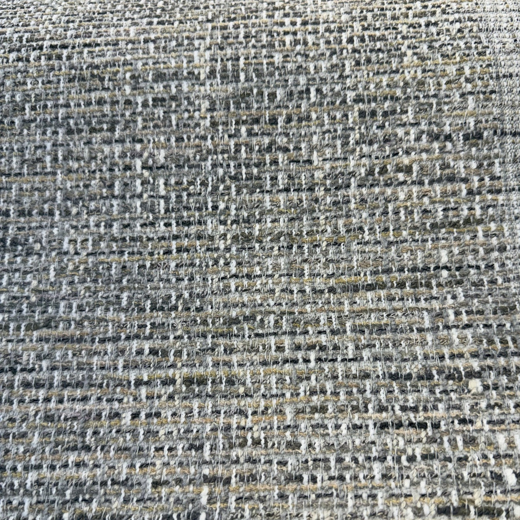 Close-up of the nubby charcoal, gray, sand and white tweed weave of Crypton Rushdie Grey