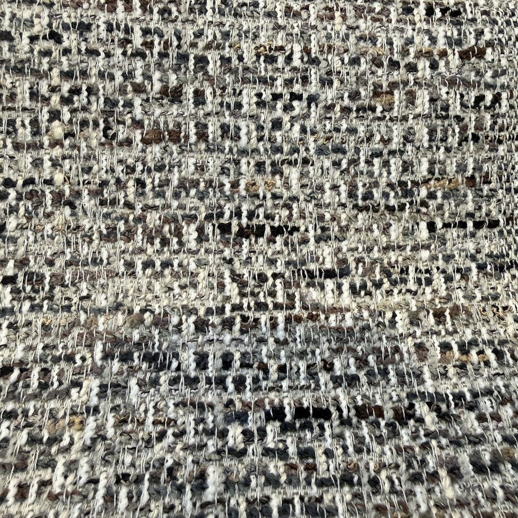 Close-up of the nubby charcoal, slate, brown and ivory tweed weave of Crypton Rushdie Charcoal