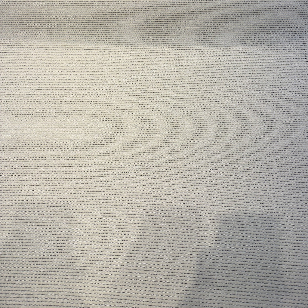 Crypton Kenzo White Pepper ribbed chenille upholstery fabric laid flat on the roll