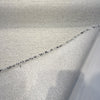 Crypton Kenzo White Pepper folded back to show the speckled white backing and cut edge