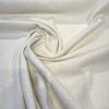 Valdese Holiday Alabaster warm off-white basketweave fabric draped in a swirl