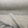 Close drape of the speckled stone gray and ivory weave on Valdese Holiday Stone Taupe