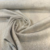 Valdese Holiday Clay Dune sandy beige basketweave fabric draped in a swirl