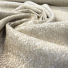 Close swirl of the chunky beige and ivory weave on Valdese Holiday Clay Dune