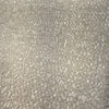 Close-up of the nubby sandy beige basketweave texture of Valdese Holiday Clay Dune