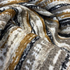 Close swirl of the plush sienna gold and black chenille stripes on Swavelle Desert Stone
