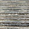 Swavelle Desert Storm Blue striped chenille upholstery fabric laid flat on the roll