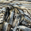 Swavelle Desert Storm Blue sky blue, brown and black stripe chenille draped in a swirl