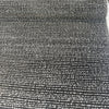 Fabricut Casio Tigereye brown and black striped boucle upholstery fabric laid flat