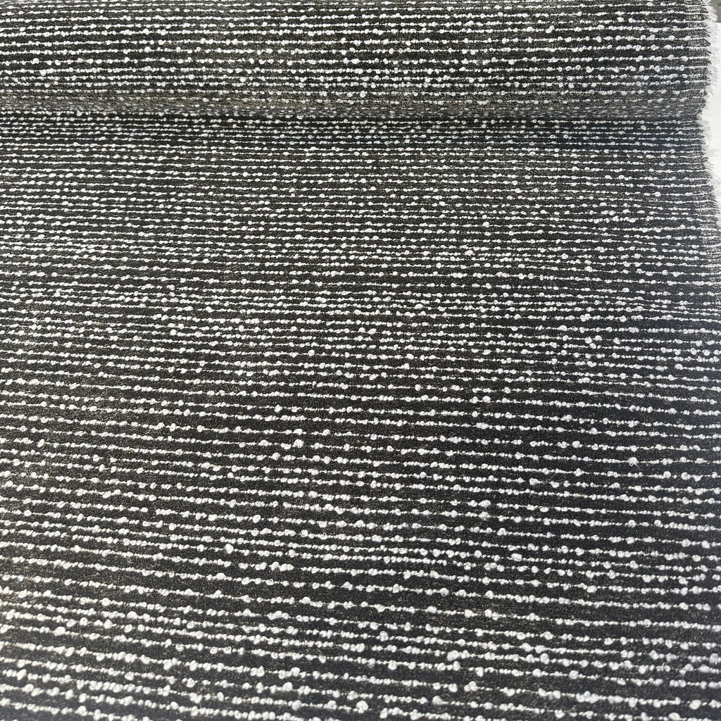 Fabricut Casio Tigereye brown and black striped boucle upholstery fabric laid flat