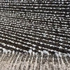 Fabricut Casio Tigereye boucle folded back to show the reverse side
