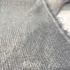 Fabricut Minetta Sky Blue boucle folded back to show the reverse side