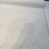 Poise White basketweave chenille upholstery fabric laid flat on the roll