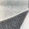 Balido White Night boucle folded back to show the charcoal reverse side
