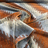 Fabricut Monza Spice rust and slate blue velvet swirled to show drape