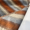 Fabricut Monza Spice velvet folded back to show the reverse side