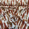 Spencer Lava abstract print fabric swirled to show drape