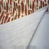 Spencer Lava print folded back to show the ivory reverse side