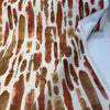 Spencer Lava rust and terracotta brushstroke fabric folded
