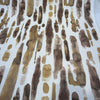 Spencer Gold Rush gold and brown brushstroke fabric on the roll